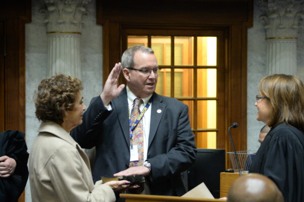 Senator Vinzant is sworn into office alongside his wife.
